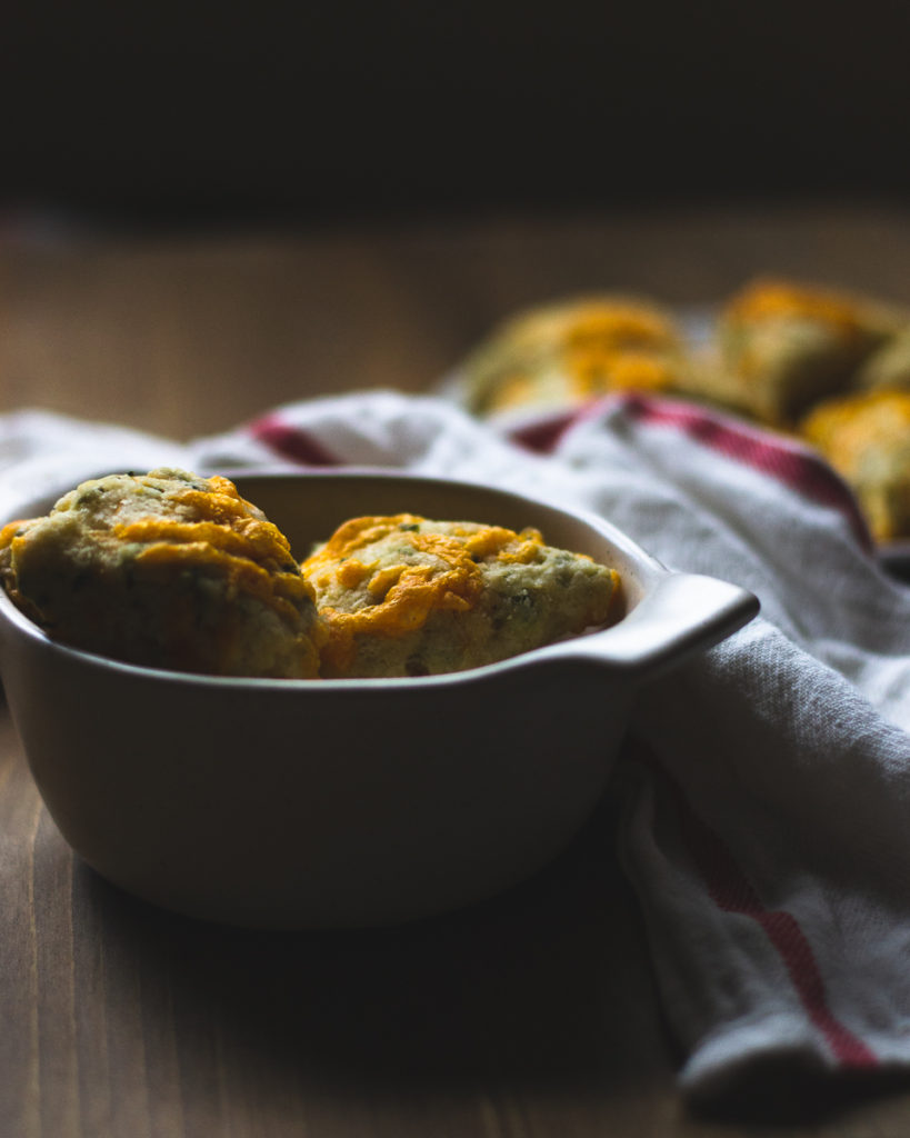 cheddar scones with chives in a serving bowl