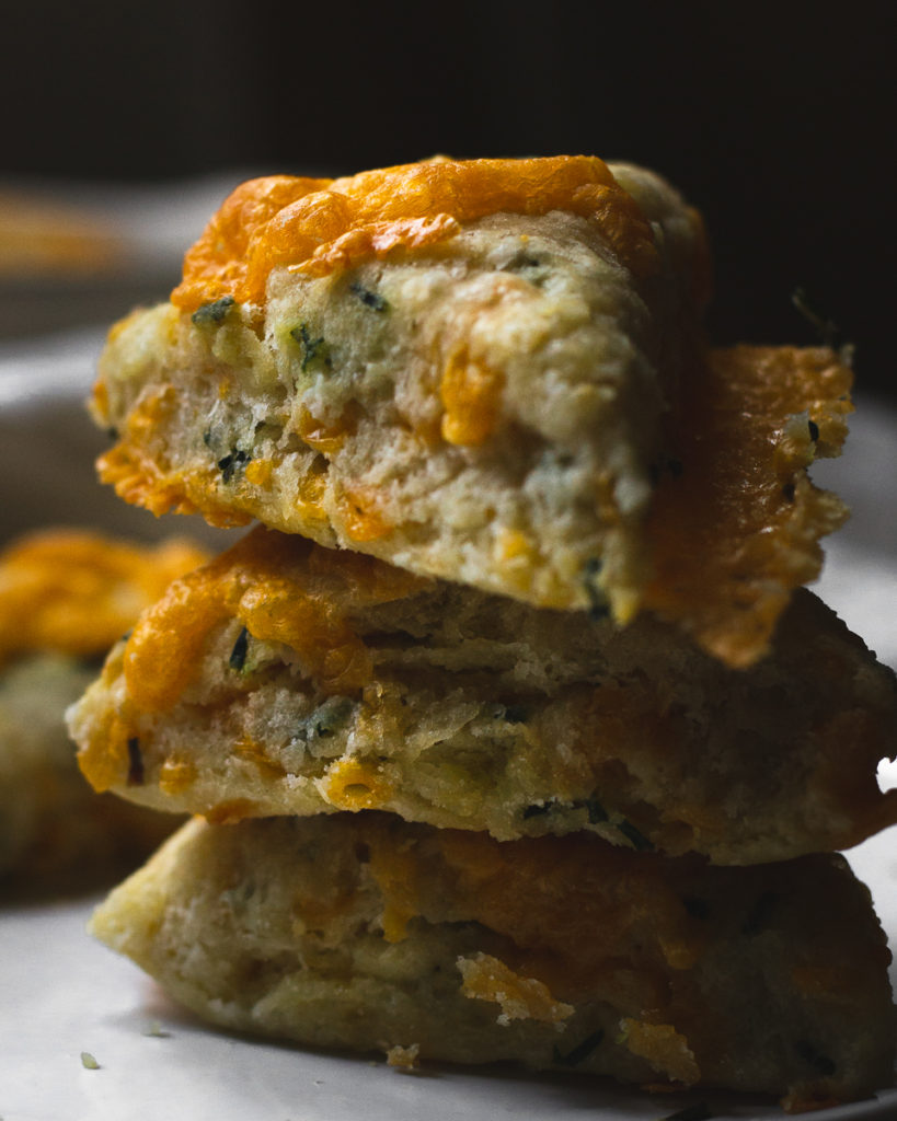 stack of three cheddar scones with chives