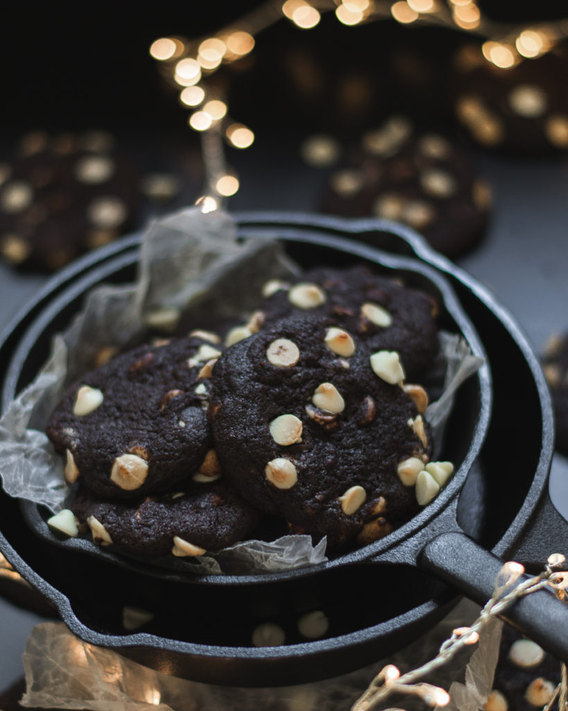 dark chocolate cookies in a cast iron skillet