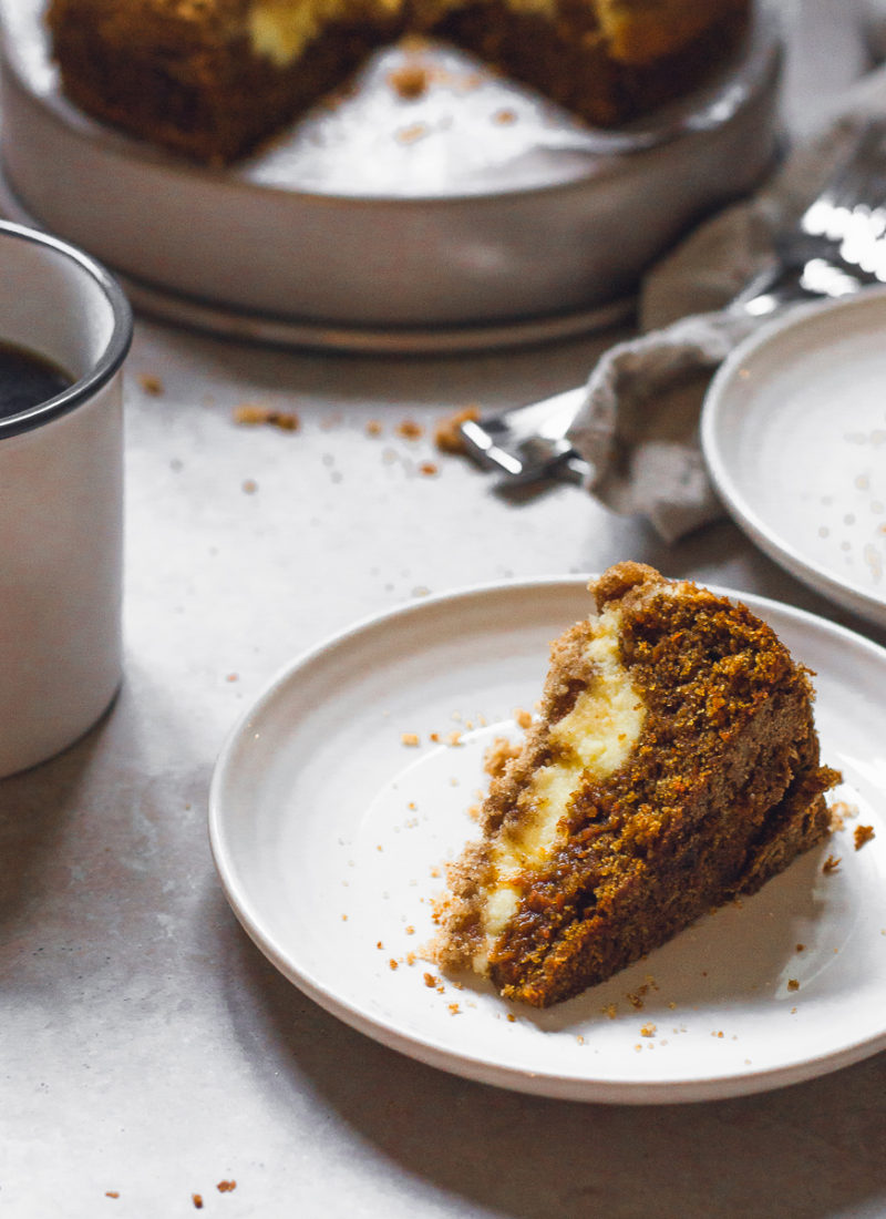 single slice of carrot coffee cake and a cup of black coffee