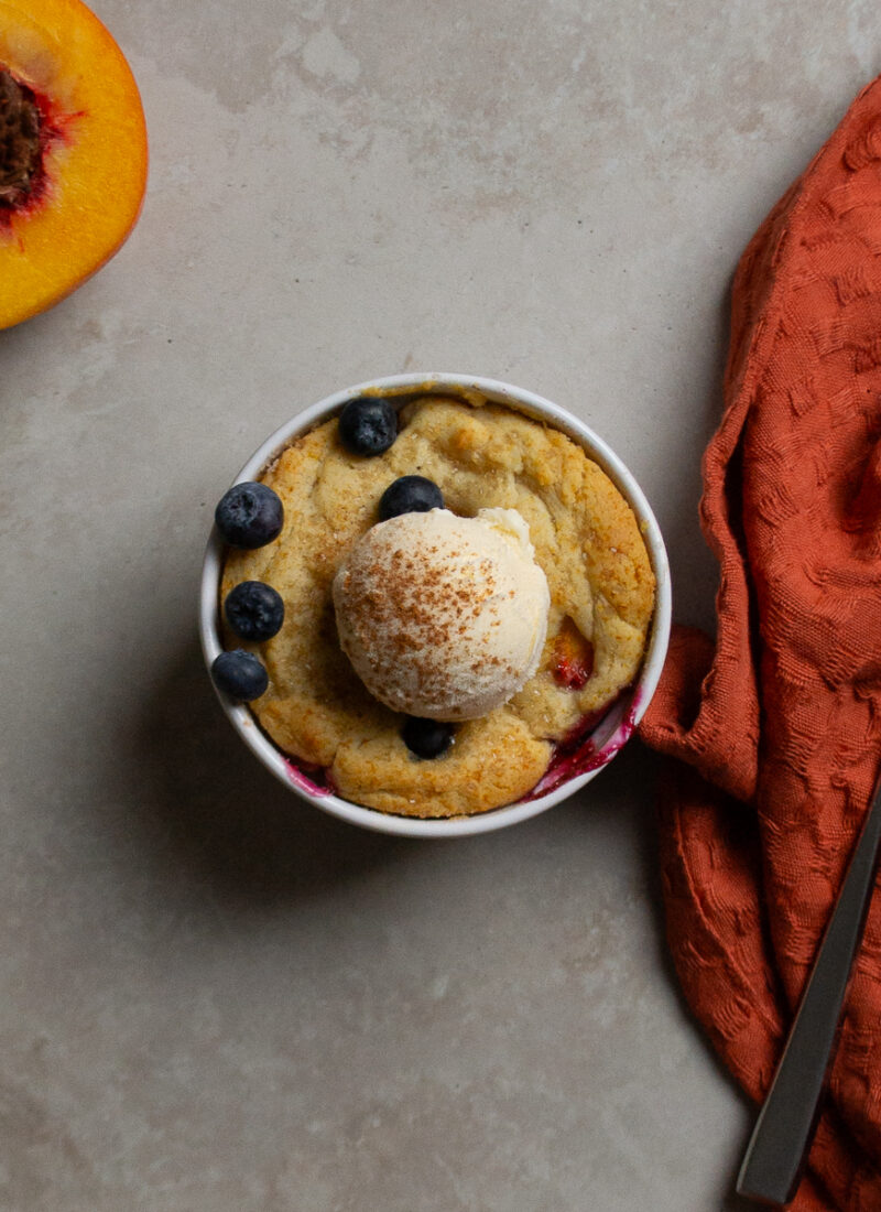 A single serving of blueberry peach cobbler for one.