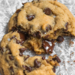 A small batch chocolate chip cookie with melted chocolate chips. Reads "Small Batch Chocolate Chips" and "ficklebeabakehouse.com"