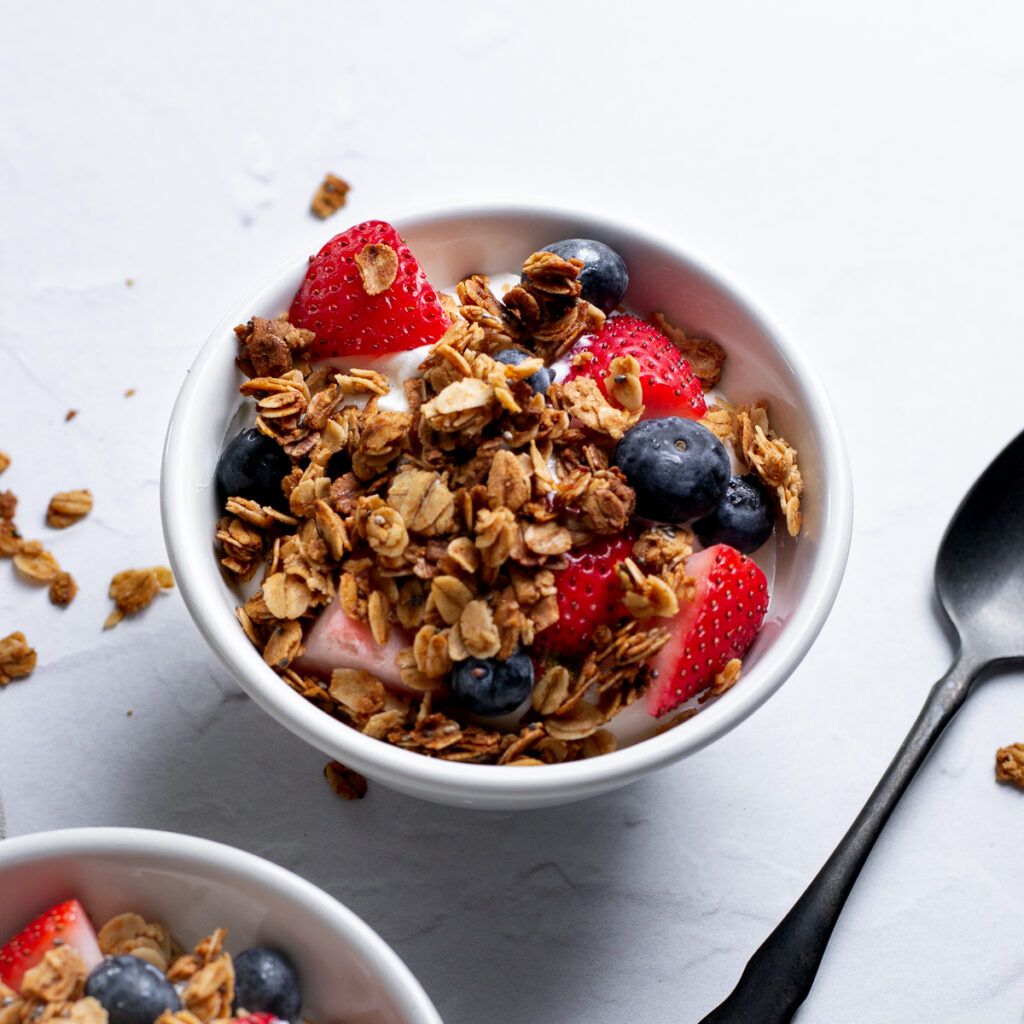 Single serving of yogurt and fruit, topped with crunchy toasted granola clusters.