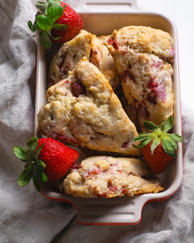 Scones and strawberries are fresh and ready for breakfast with friends.
