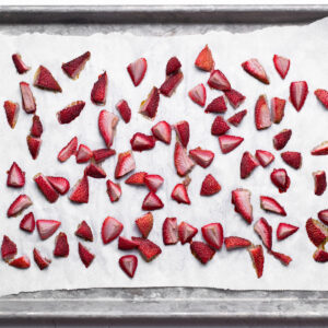 Roasted strawberry pieces that will cool before being added to the scone dough.