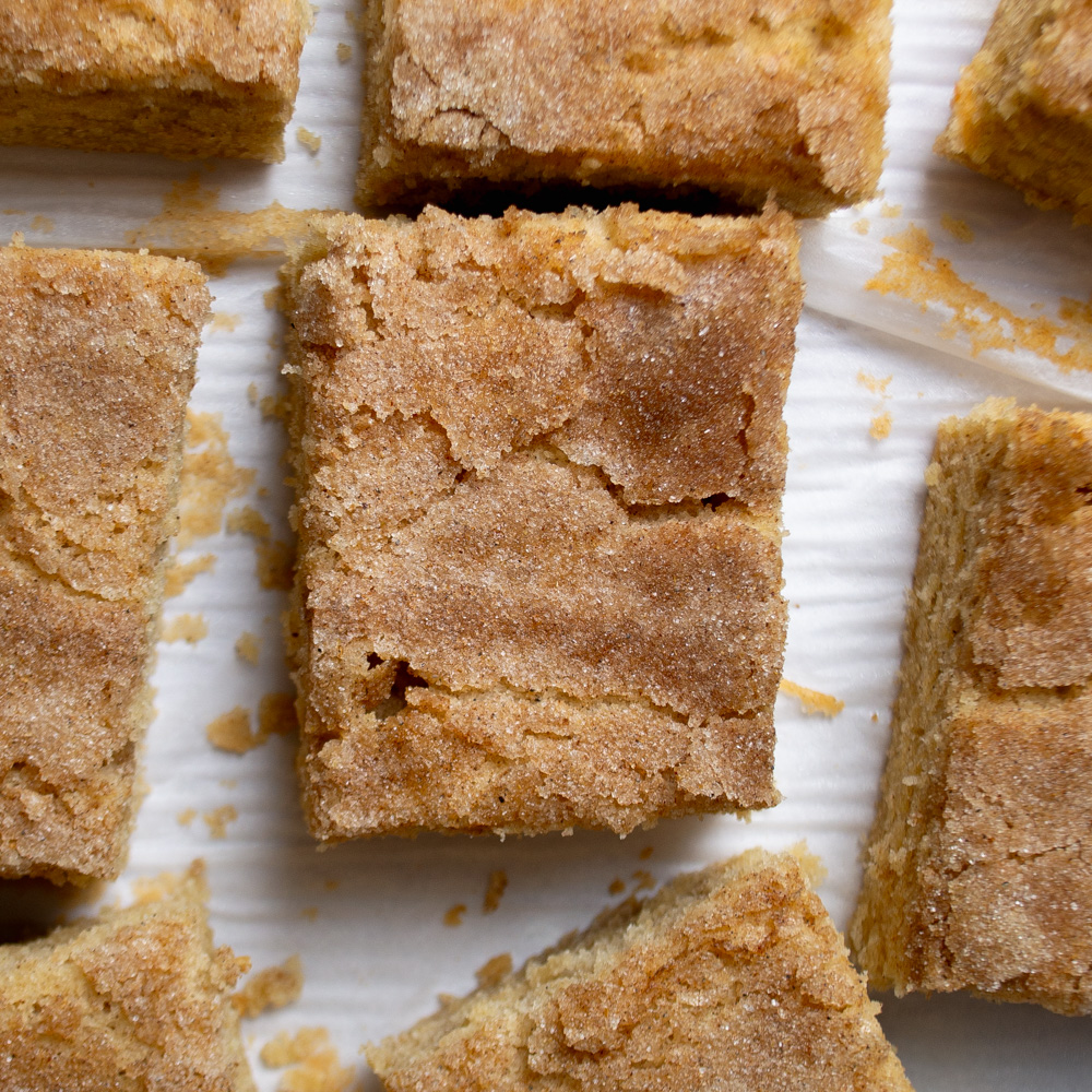 Cardamom coffee cake, cut into squares. Ready to be shared at breakfast or brunch!