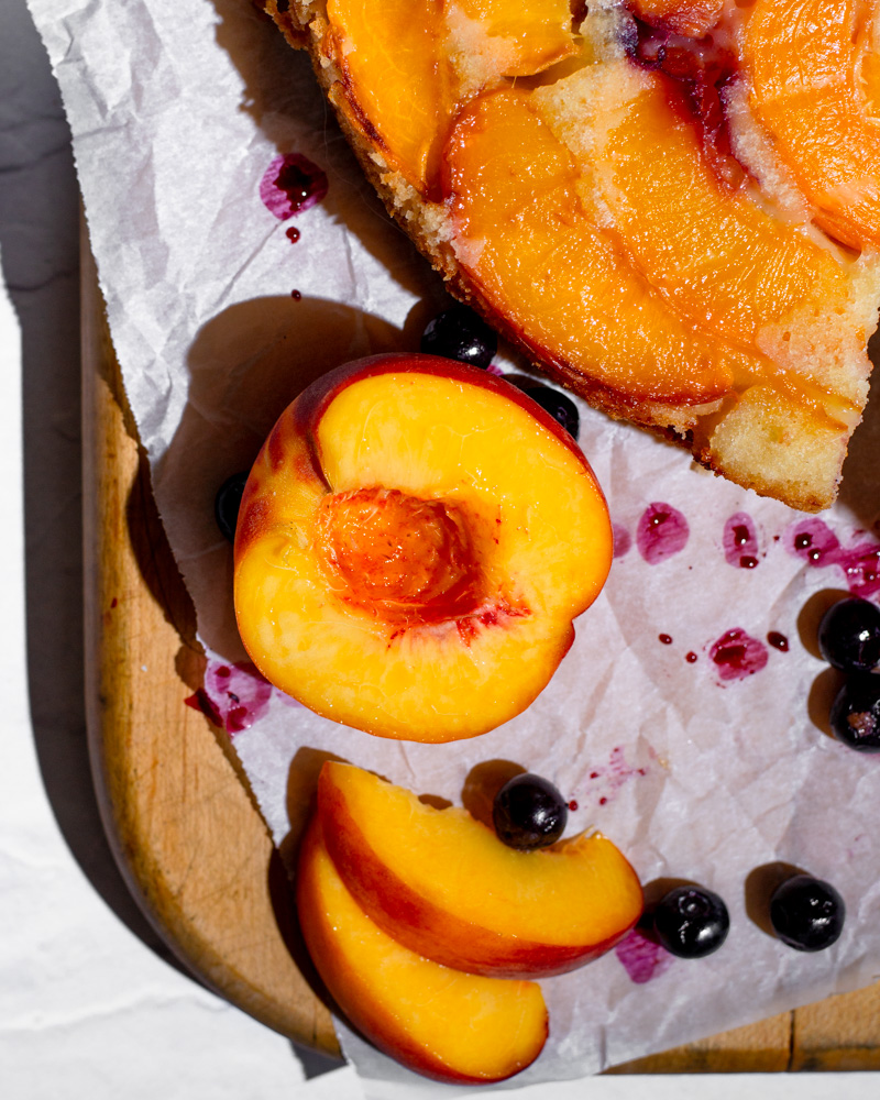 Fresh peaches are the star of this blueberry peach upside-down cake and are perfectly complemented by a lemon juice soak and frozen blueberries mixed into the batter.