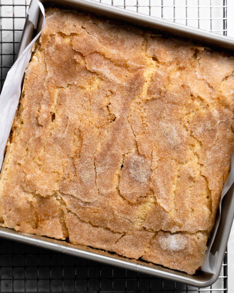 Warm and moist cardamom coffee cake with a crackled cardamom sugar top.