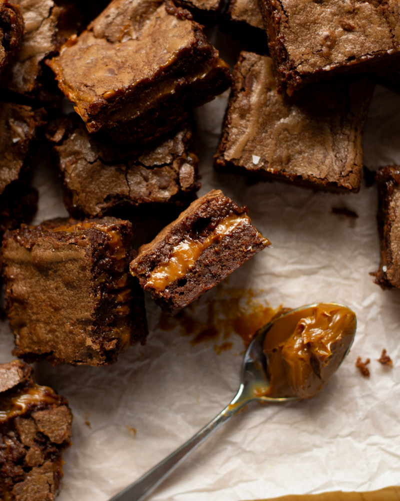 The perfect salted dulce de leche brownie with a creamy layer of dulce de leche running through the middle.