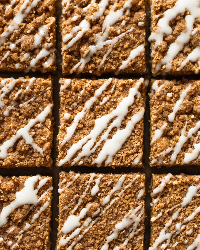 Perfectly moist and cozy pumpkin spice coffee cake with cinnamon streusel crumble and a vanilla icing drizzle.