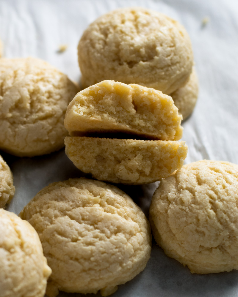 Perfectly golden drop style no chill sugar cookies, fresh out of the oven and ready to be shared with friends.