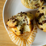 Fluffy, moist chocolate chip muffins with mini chocolate chips and topped with crunchy turbinado sugar. The perfect sweet breakfast or brunch!