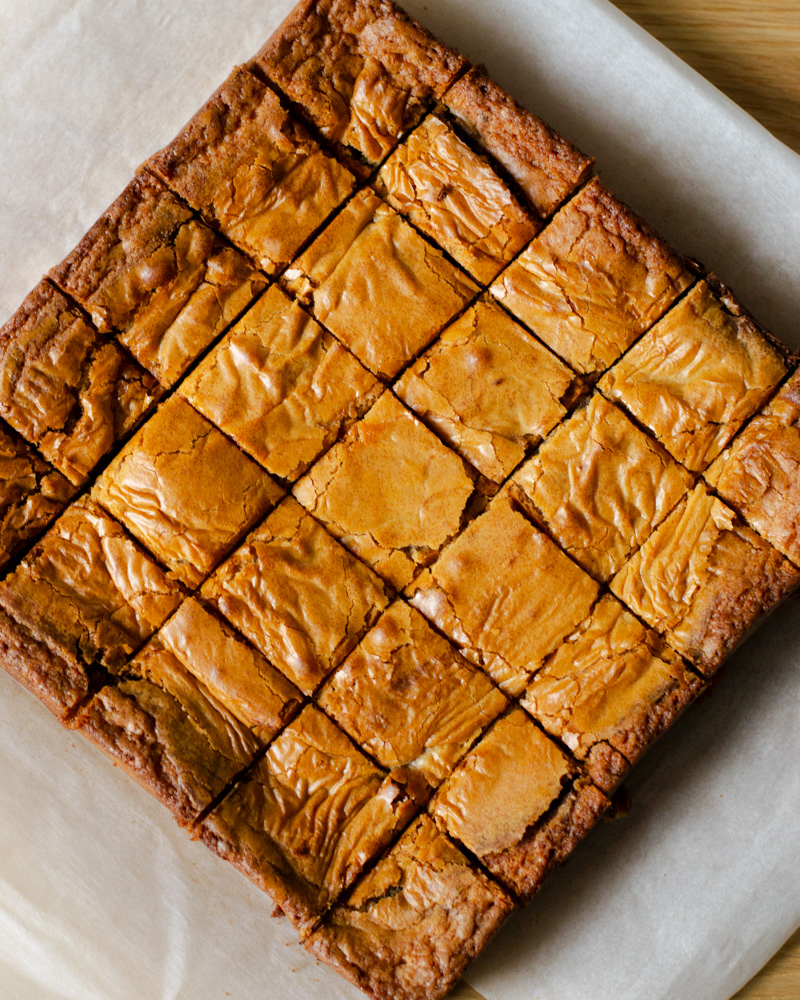 Freshly cut malted Nutella blondies, ready to be shared with friends.