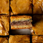 Golden brown malted Nutella blondies with gooey Nutella filling.