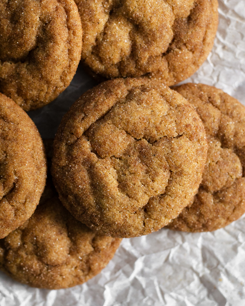 Warm and soft pumpkin spice snickerdoodles, fresh out of the oven with their slightly crinkly tops, crunchy sugar, and pillow soft centers.