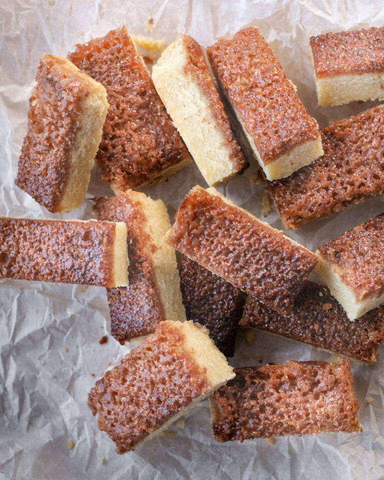 Buttery vanilla shortbread bars topped with a broiled cinnamon sugar spread. Tender broiled cinnamon sugar shortbread bars.