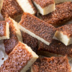Buttery vanilla shortbread bars topped with a broiled cinnamon sugar spread, ready to be enjoyed after cooling. Delicious broiled cinnamon sugar shortbreads ready to be shared.