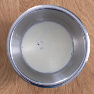Steamed milk poured over semi-sweet chocolate chips and kosher salt, then left alone for five minutes.