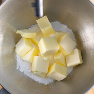 Butter, salt, and powdered sugar before getting creamed together to make vanilla thumbprint cookies.
