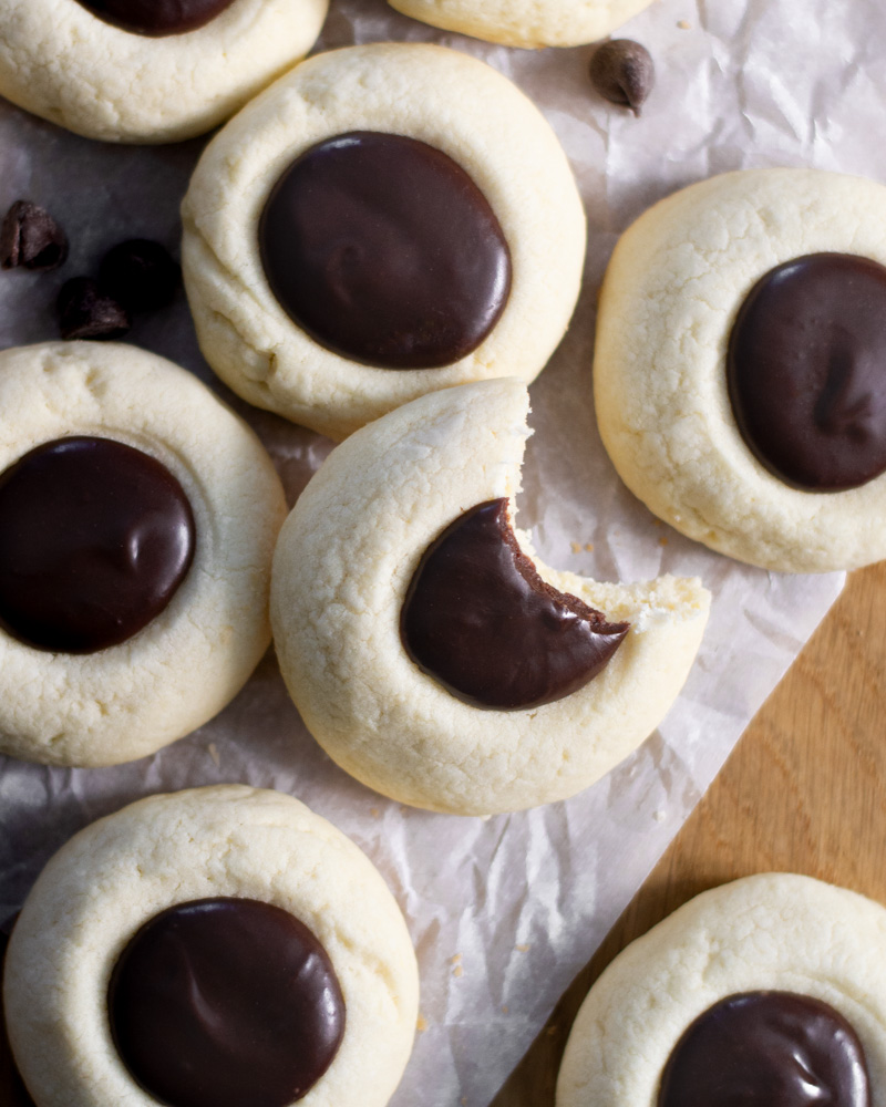Vanilla thumbprint cookies filled with a smooth and delicious semi-sweet chocolate ganache.