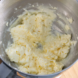 Dough for vanilla thumbprint cookies after adding the eggs, but before everything has been fully mixed together.